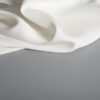 Tejido Begoodtex ignífugo con aspecto de seda, superficie de poliéster y elastano blanco